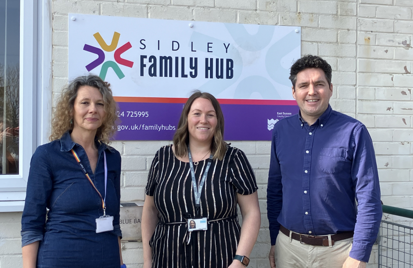 Huw standing outside Sidley Family Hub with Tina Pelini and Aimee Richards