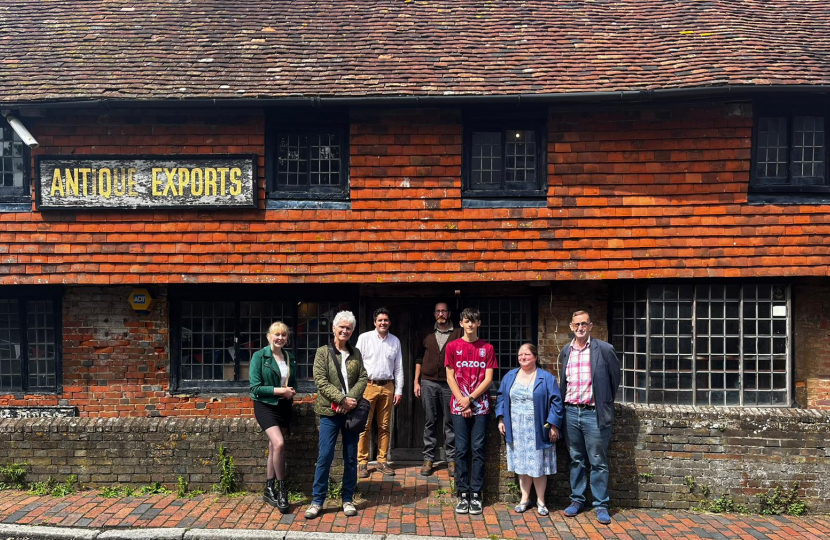 Outside Mint House with charity trustees