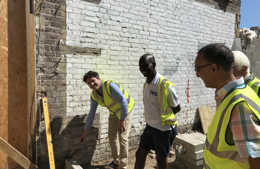 Huw laying first brick