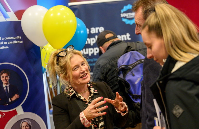 Image of exhibitor in deep conversation with attendee