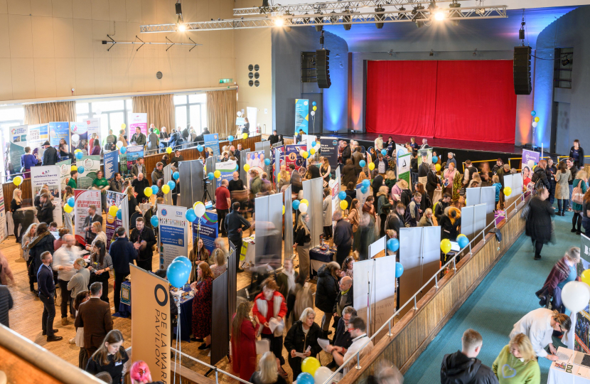 Photo taken at Bexhill Jobs Fair of room full of people having conversations