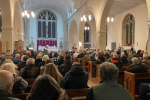 Photo of public meeting on Northeye from rear of church
