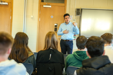 Huw talking to students at Bexhill College