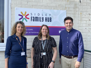 Huw standing outside Sidley Family Hub with Tina Pelini and Aimee Richards