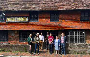 Outside Mint House with charity trustees