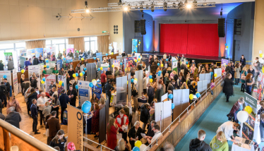 Photo taken at Bexhill Jobs Fair of room full of people having conversations